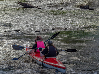 Two Seat Canoe Heading for Rocks