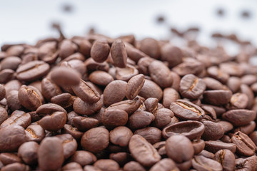 brown background of coffee grains in dropcopy space.