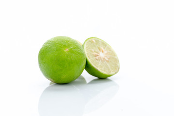 Fresh green lemon fruit isolated on white background.