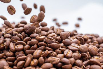 brown background of coffee grains in dropcopy space.
