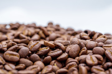 coffee beans close up on a white isolated background,copy space.