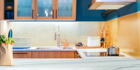 Wood table top on blurred kitchen background