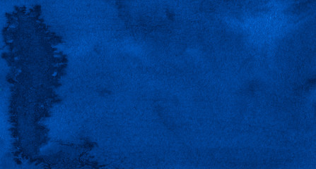 Classic blue watercolor background with torn strokes and uneven stains. Abstract indigo background for design, template and pattern.