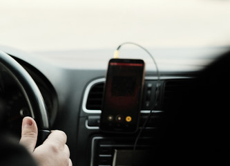 The driver's hand with the Navigator on the phone. You can put into your browser to any picture