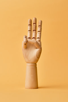 Wooden Human Hand With Three Fingers Raised Up