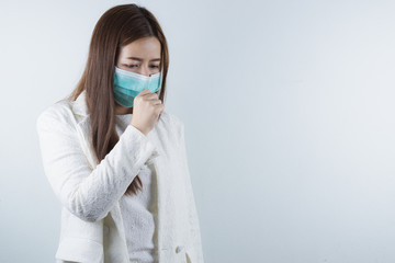 The business girl wearing mask for protecting coronavirus and pm 2.5 and she coughing flu from coronavirus. Coronavirus and Air pollution pm 2.5 concept.