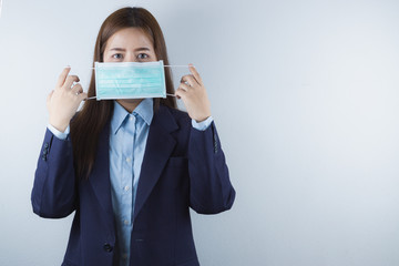 The business woman wearing protection face mask against coronavirus, PM 2.5 and cold. Coronavirus and Air pollution pm 2.5 concept.