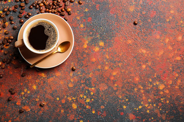 Cup of hot coffee on grunge background