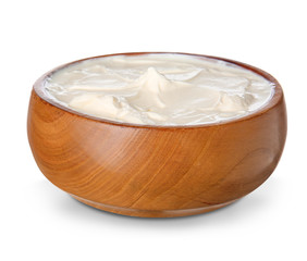 Bowl with tasty sour cream on white background