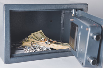 Fototapeta Safe box with valuables on light background obraz