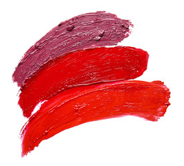 Fototapeta premium Strokes of bright lipsticks on white background