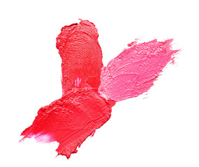 Strokes of bright lipsticks on white background