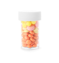 Bottle with different pills on white background