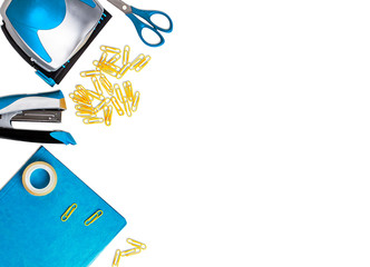 Office tools: hole puncher, stapler, notebook, paper clips, Scotch tape, scissors on a white...