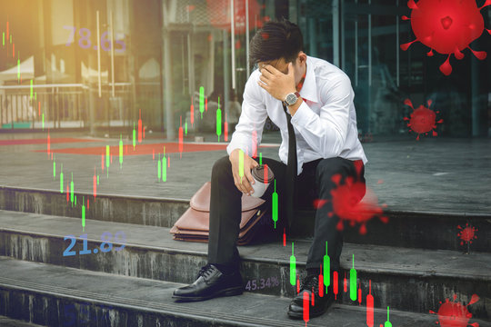 People unemployed businessman stress sitting on stair, concept of business failure and unemployment problem. stock market crash caused by the Coronavirus, economic graph with diagrams,