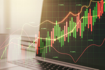 Multi exposure of abstract financial graph on laptop background, financial and trading concept