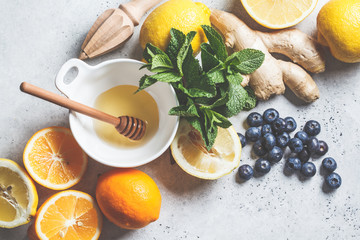 Healthy ingredients for immunity and anti-flu. Citrus fruits, ginger, honey, blueberries and mint...