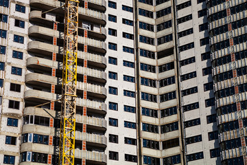 Fototapeta premium Unfinished high-rise apartment building.