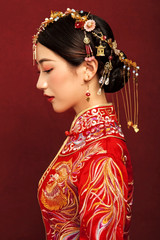 Asian brides in red wedding vintage dress on red background