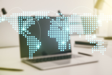 Abstract creative world map with connections on modern laptop background, international trading concept. Multiexposure