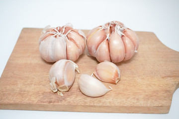 garlic on a wooden tray