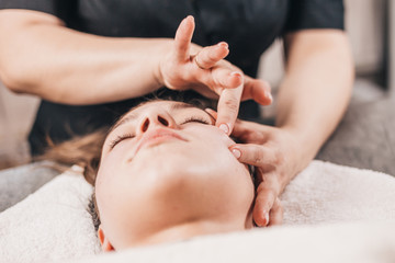 Facial massage in the eye area - from the outer part of the eye to the inner lower eyelid and from...