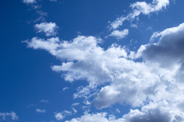 Naklejka na ściany i meble Clean sky with air fluffy clouds beautiful background.