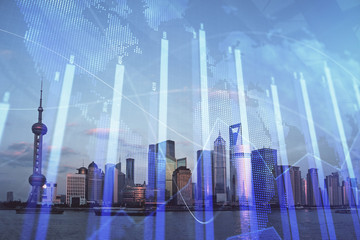 Obraz premium Forex graph on city view with skyscrapers background double exposure. Financial analysis concept.