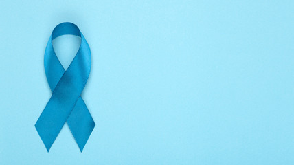Blue ribbon on background. Prostate cancer awareness month. Blue ribbon symbol of world prostate cancer month and concept of healhcare. Copy space
