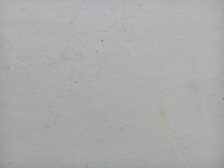 Stain on old white paper sheet texture background. Stained paper. Aged paper background. White aged.