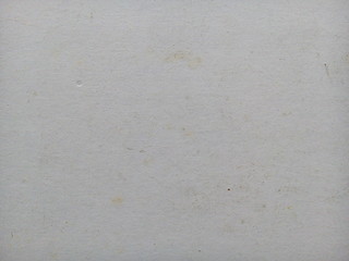 Stain on old white paper sheet texture background. Stained paper. Aged paper background. White aged.