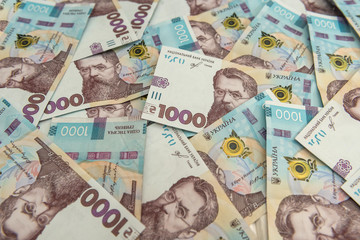 Background of new 1000 500 200 UAH  banknotes on desk. money and save concept. Financial background