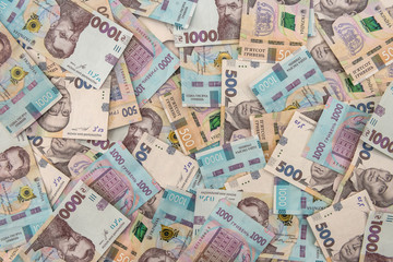 Background of new 1000 500 200 UAH  banknotes on desk. money and save concept. Financial background