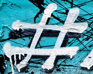 symbol hashtag painting on a blue wall background