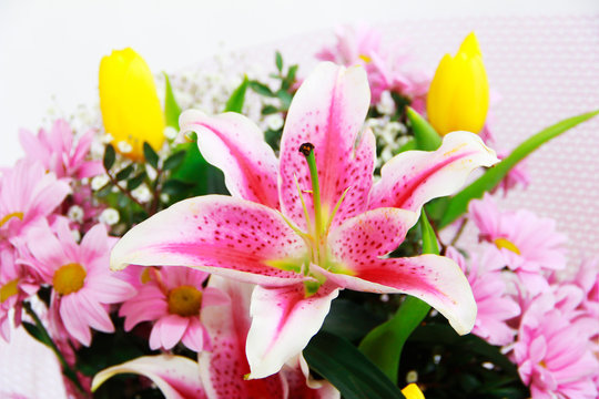 bouquet of natural large pink lilies, chrysanthemums and tulips
