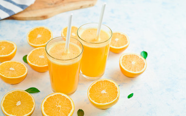 orange juice in a glass, top view, slices of oranges, straw, healthy lifestyle concept