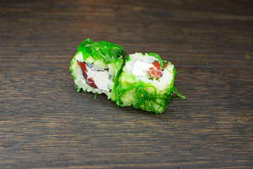 sushi with philadelphia cheese, salmon and chuka salad