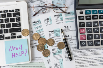 Tax concept. Need help wtite on sticker, coin us, calculator and 1040 american tax form