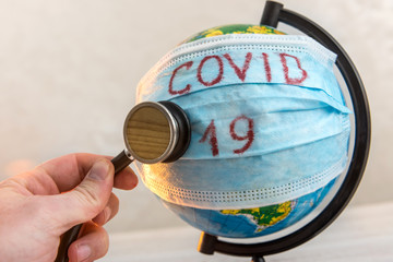 Novel coronavirus from wuhan- 2019-nCoV earth globe with stethoscope and mask , virus concept.