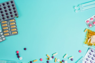 coronavirus tablets top view. background image. capsules and tablets with blisters on a blue background. treatment of infection during a pandemic