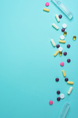 coronavirus tablets top view. background image. capsules and tablets with blisters on a blue background. treatment of infection during a pandemic