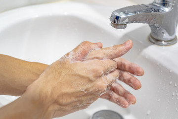 Washing hand with soap and water