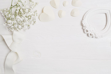 mockup background with flowers and paper hearts for greeting card St. Valentine's Day in rustic...