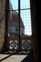 Firenze, Italy - April 21, 2017: The Duomo and  Brunelleschi cupola in Florence view from a window, Firenze, Tuscany, Italy