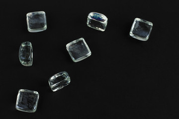 Glass cubes on a black background. Abstract concept with copy space.