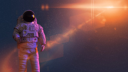 standing astronaut in front of the Sun © dottedyeti