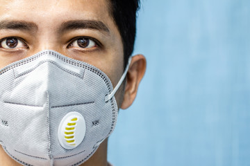 A man is wearing n95 mask for protect covid 19 and air pollution pm2.5