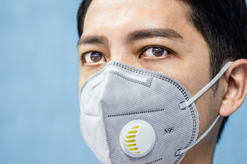 A man is wearing n95 mask for protect covid 19 and air pollution pm2.5