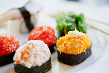 Sushi serving on a plate in restaurant