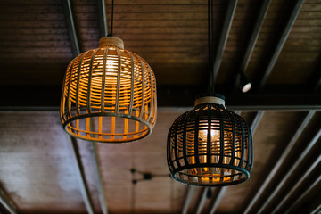 Two asian lamps hanging from the ceiling in Thailand